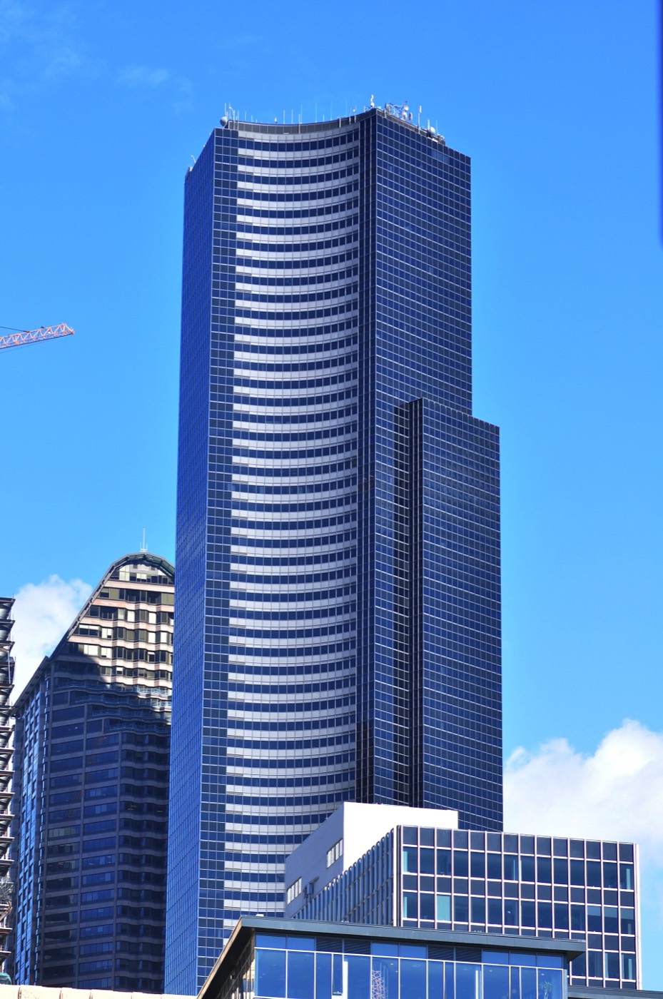 Columbia Center in Seattle seen from Colman Dock on the waterfront — a black three-lobed tower standing well above every other building on the skyline.