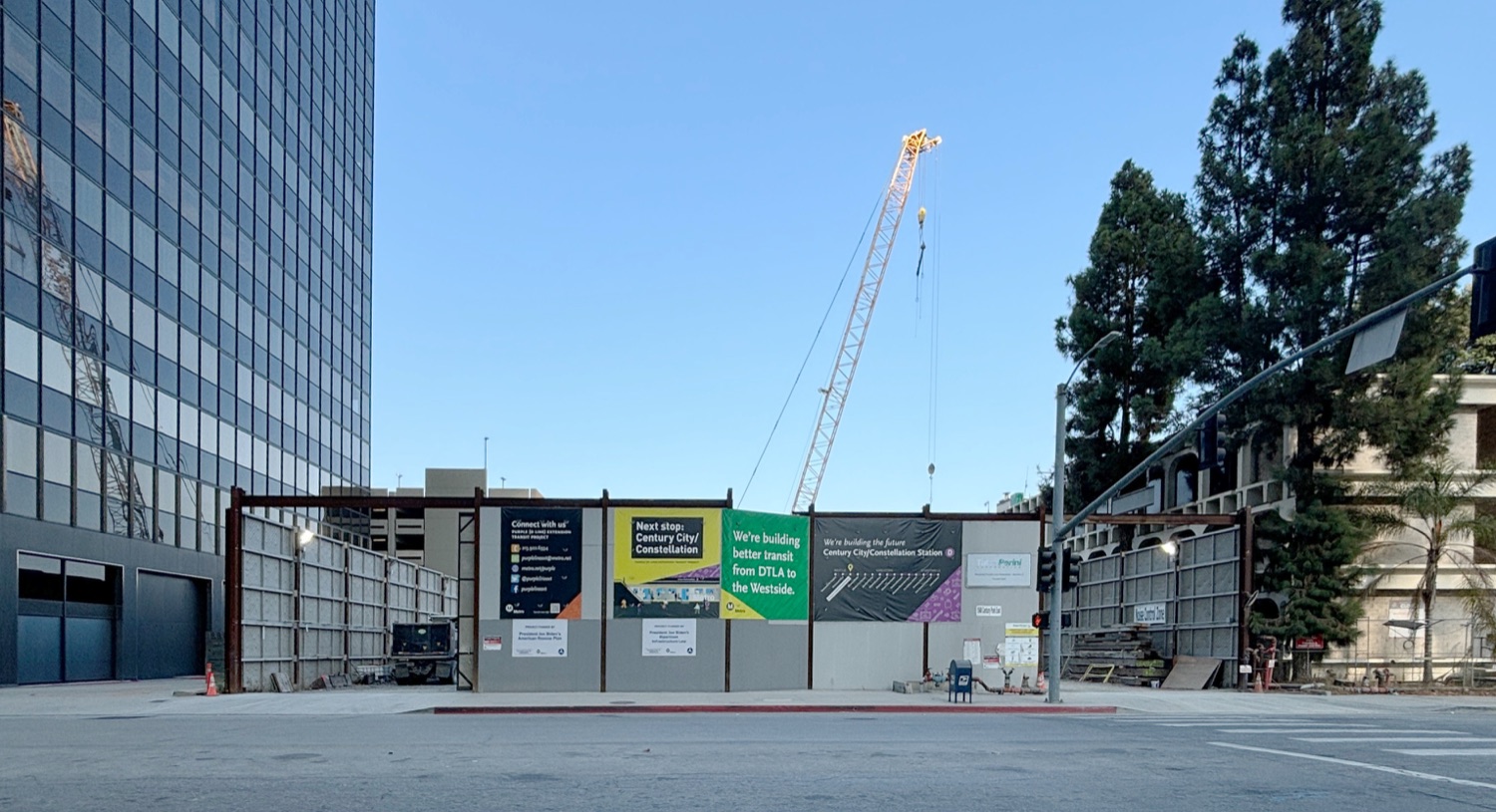 The Century City/Constellation station construction site in September 2024 — a crane above construction hoarding on Constellation Boulevard reading “Next stop: Century City/Constellation.”