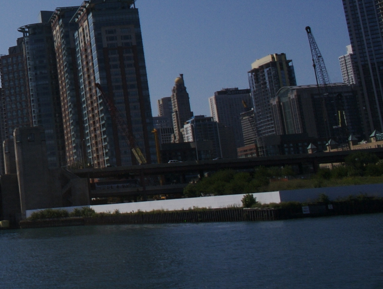 The fenced DuSable Park peninsula and the Chicago Spire construction site together in one 2007 frame, at the mouth of the Chicago River.