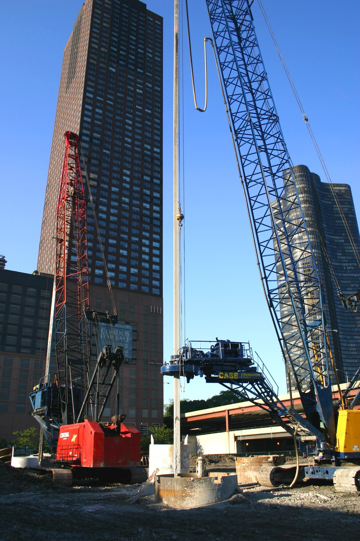 The Chicago Spire construction site in August 2007 — a drilling rig working on the circular caisson ring, with Lake Point Tower behind.