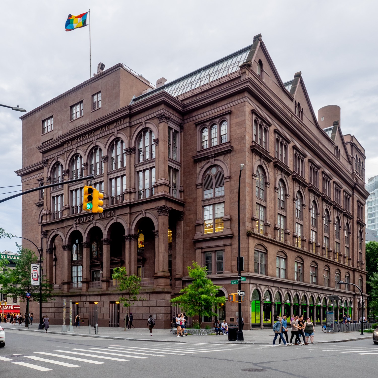 The Cooper Union Foundation Building in Manhattan’s East Village — a six-storey brownstone of 1859 with arched windows, seen from the north-east across Cooper Square.