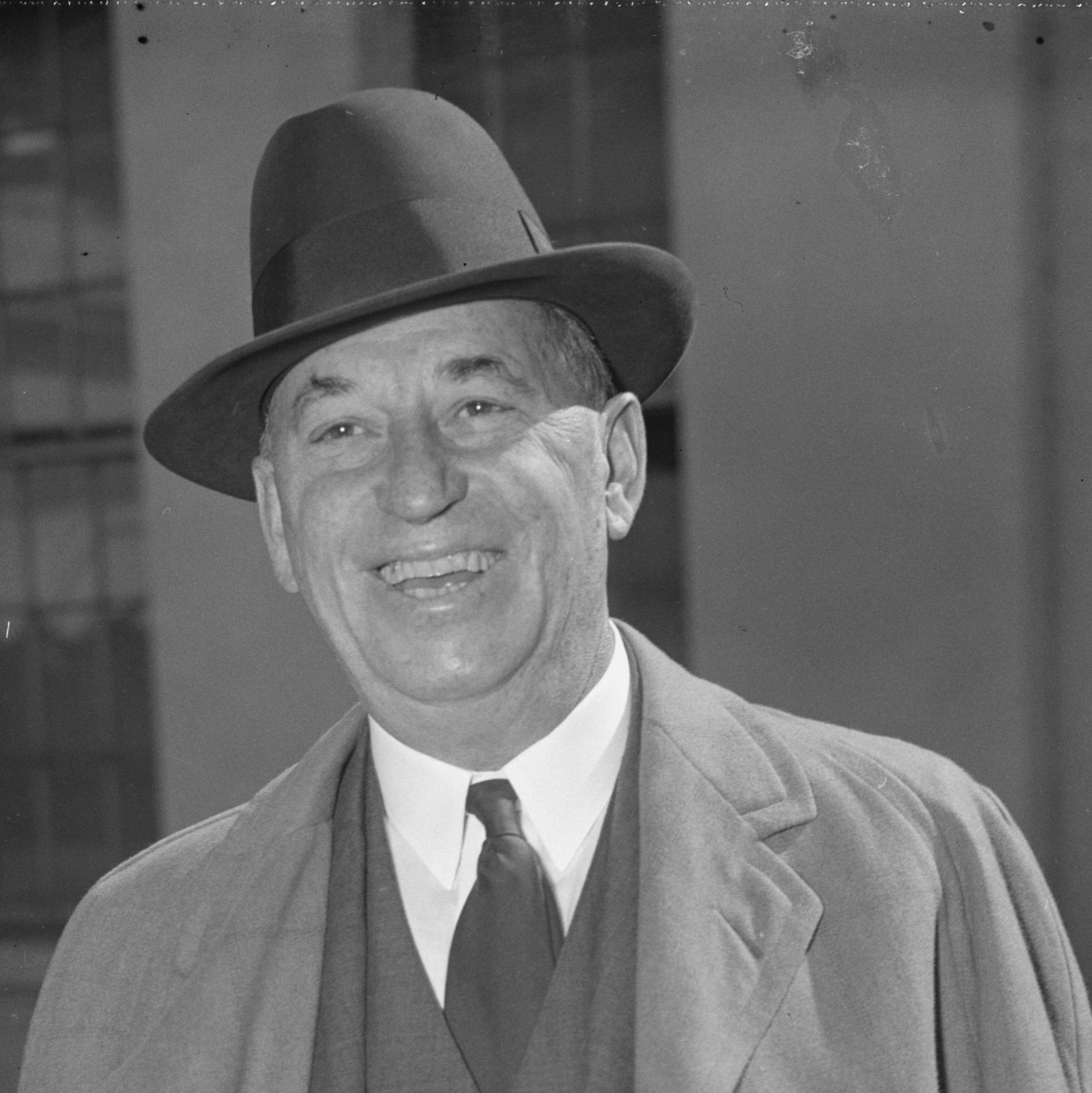Walter P. Chrysler in a dark overcoat and hat, photographed outdoors in Washington in the 1930s.