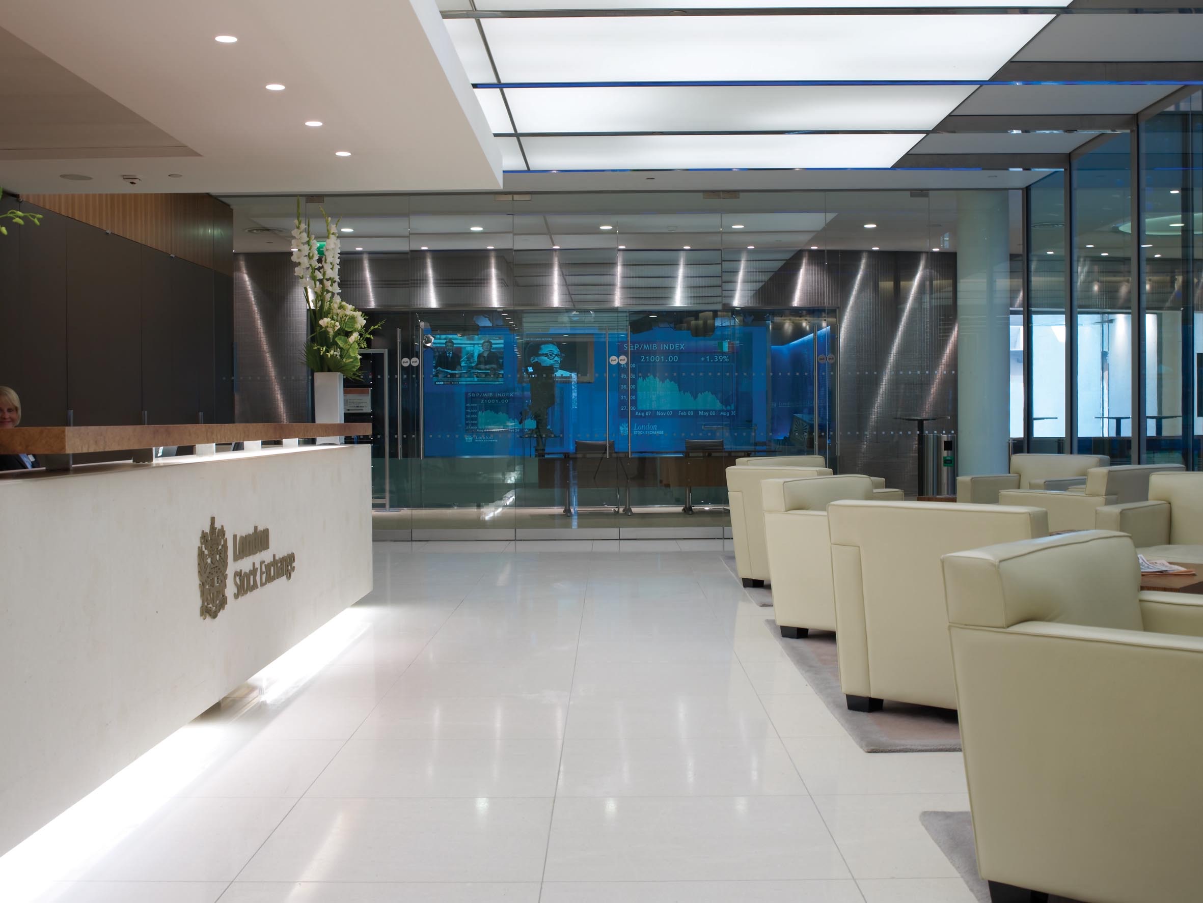 The London Stock Exchange building on Paternoster Square, its glass facade carrying the exchange’s name.