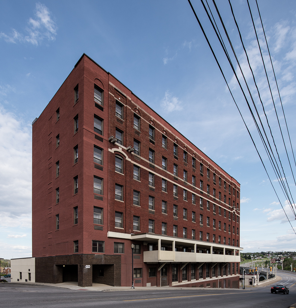 Eastview Unity Apartments in Fairmont, West Virginia — a red-brick subsidized apartment building for elderly and disabled residents, converted from the old Fairmont Hotel.