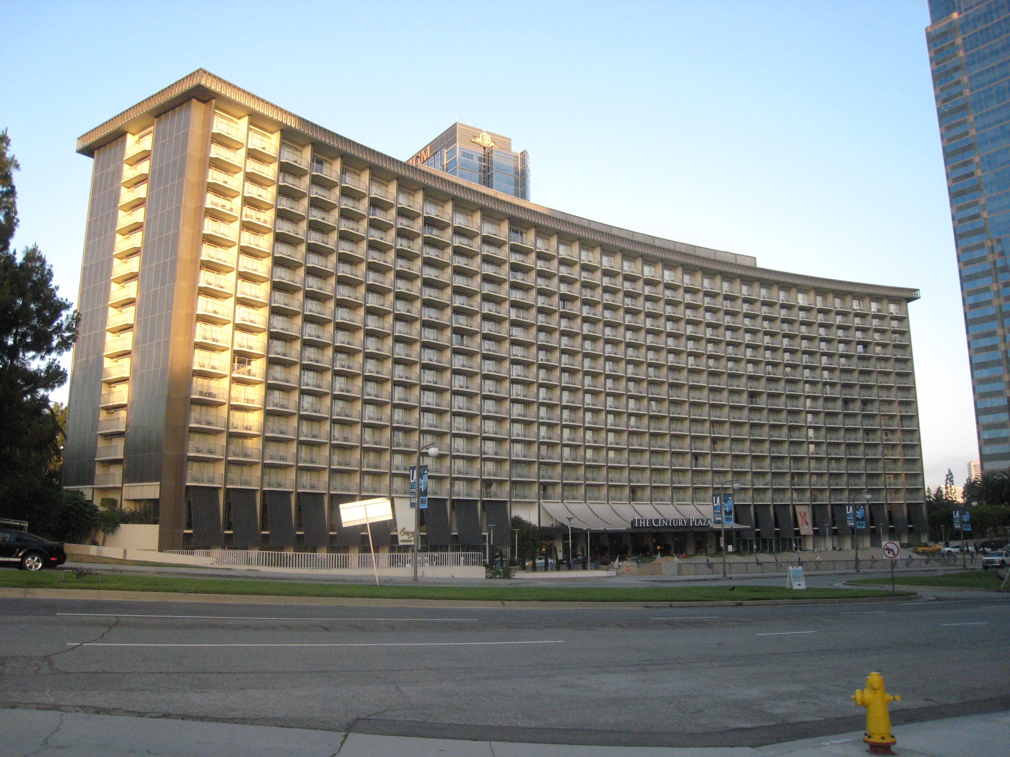 The Century Plaza Hotel in June 2008 — the nineteen-storey crescent in evening light, with the MGM tower behind it.