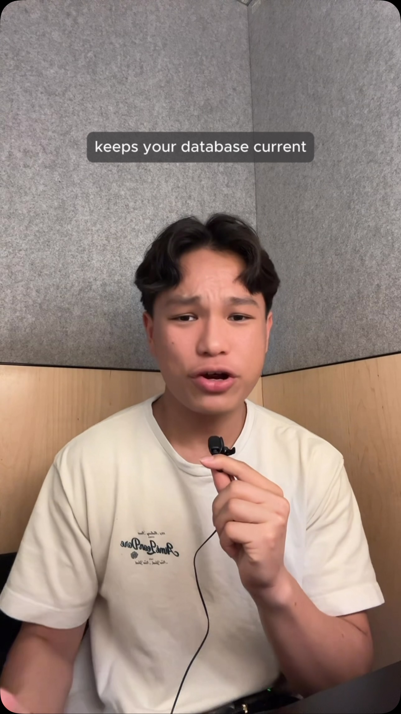Fintok presenter holding a microphone; on-screen caption reads “keeps your database current”.