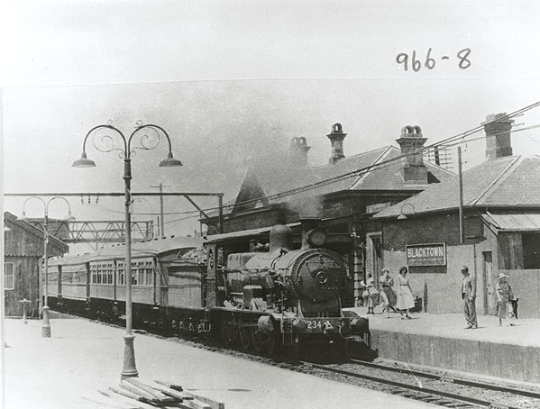 Blacktown railway station with a steam train, 1955