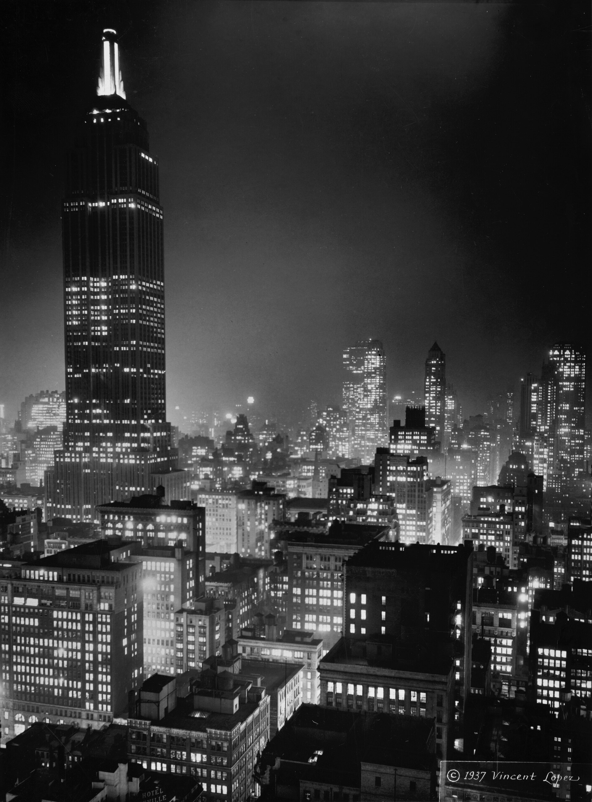 The Empire State Building lit at night over midtown, 1937 (Vincent Lopez)
